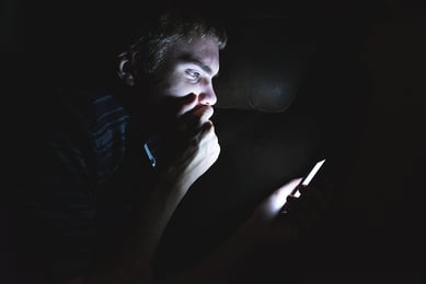 Man on mobile phone in the dark